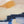 Abstract art, close up of painting on canvas with blue, orange, and white brush strokes